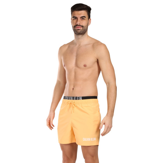 Vyriški maudymosi kostiumėliai Calvin Klein orange (KM0KM00992-SAN)